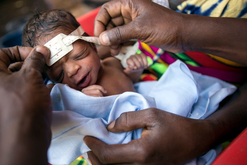 Child being head measured 